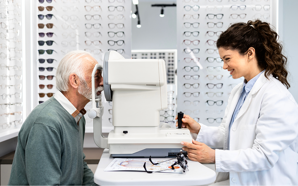 optometrist-checking-senior-mana-eyesight